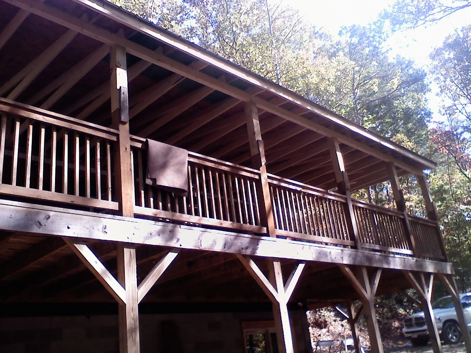 Timber framing under a new elevated porch and deck — Roof Leak Repair in San Miguel by Roofing Brothers